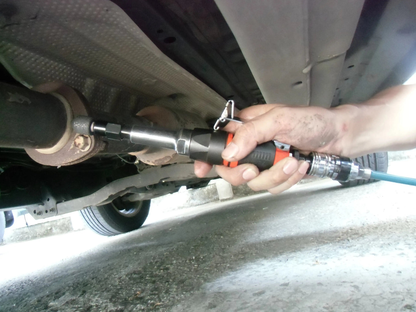 a close up of a person working on a vehicle